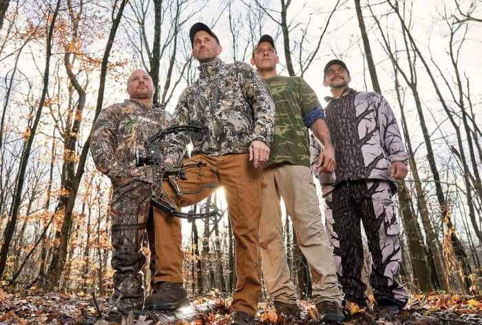 DRESSED TO KILL
Melillo (holding bow) with Wayne Davis (second from right), who helped track the bear, and hunting buddies Marc Yodice and Jason Famularo.